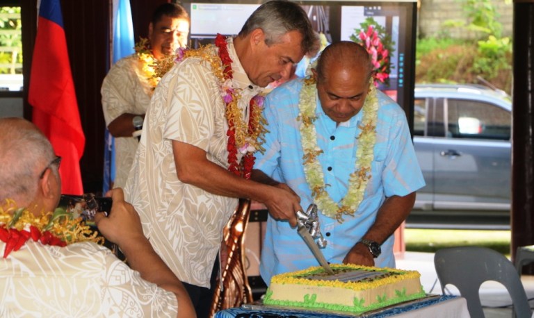 UNDP Resident Representative, Jorn Sorensen (left) with the Minister of Education, Seuula Ioane Tua'au cutting the cake at the launch of the national digital library on Monday this week.