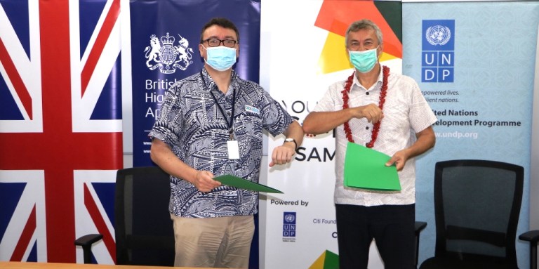 British High Commissioner to Samoa, H.E. David Ward with UNDP Resident Representative, Jorn Sorensen after signing the funding support for the mentorship programme.