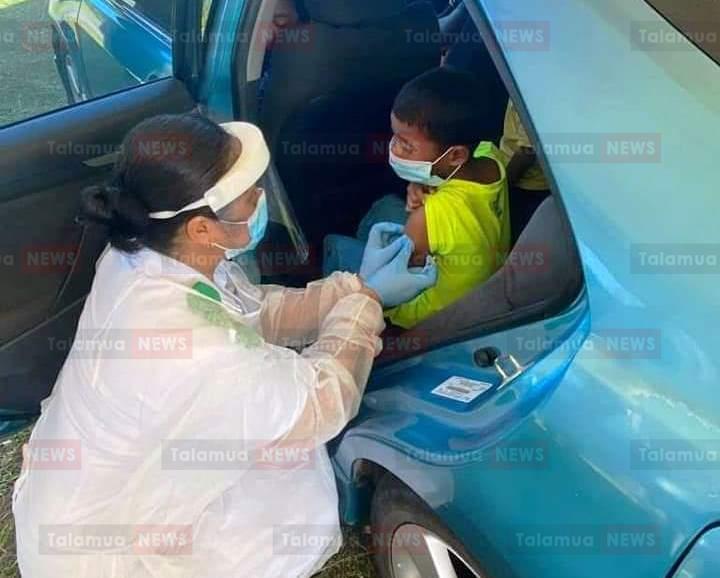Vaccinating child in car