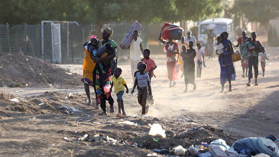 Sudanese people fleeing