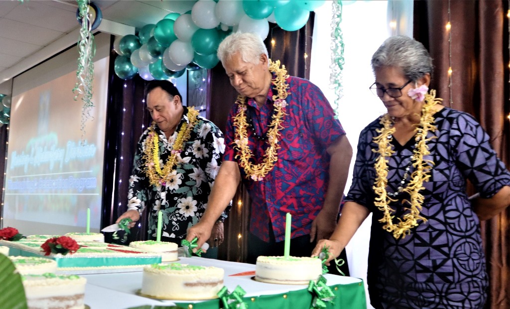 Nurses cutting cake