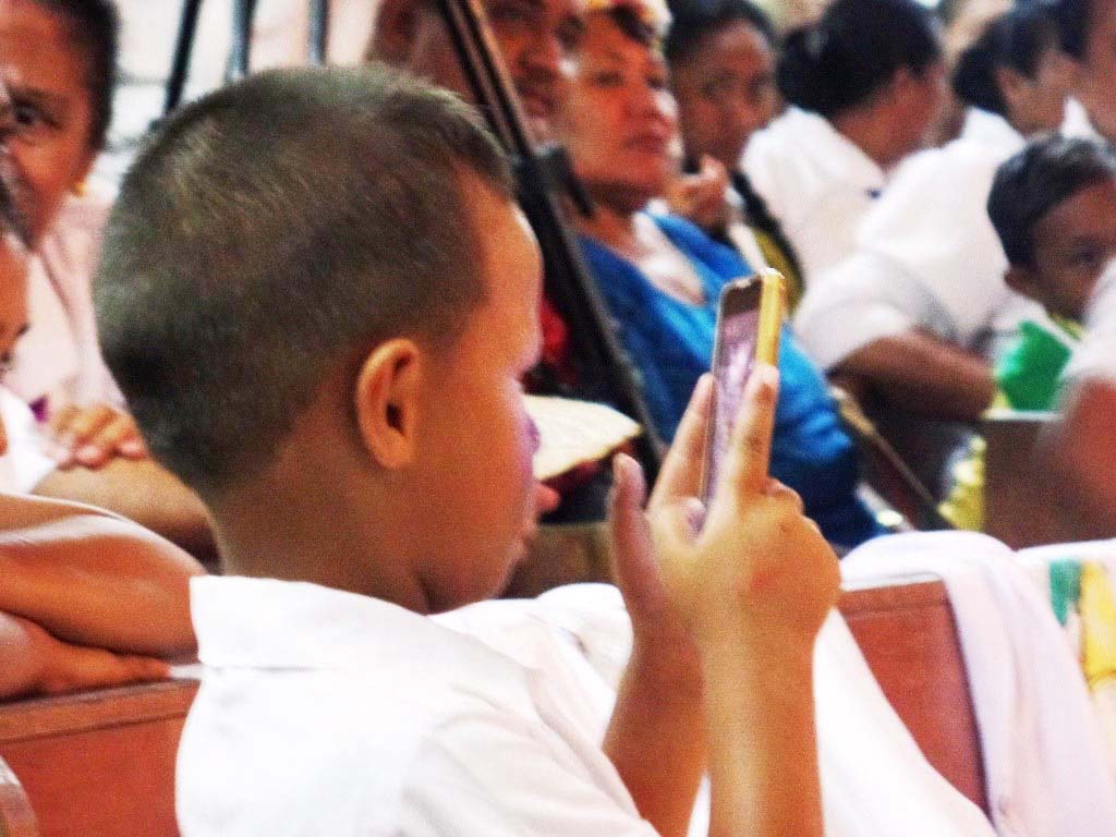 Child filming with phone