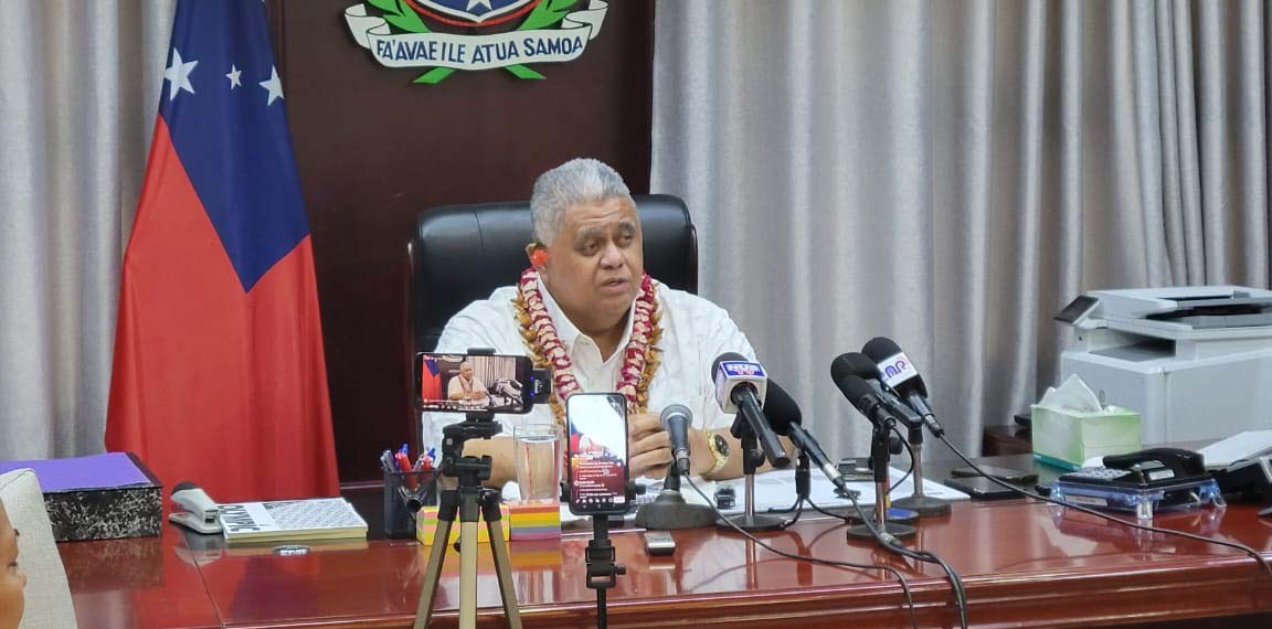 prime minister Laauli facing the media in his office