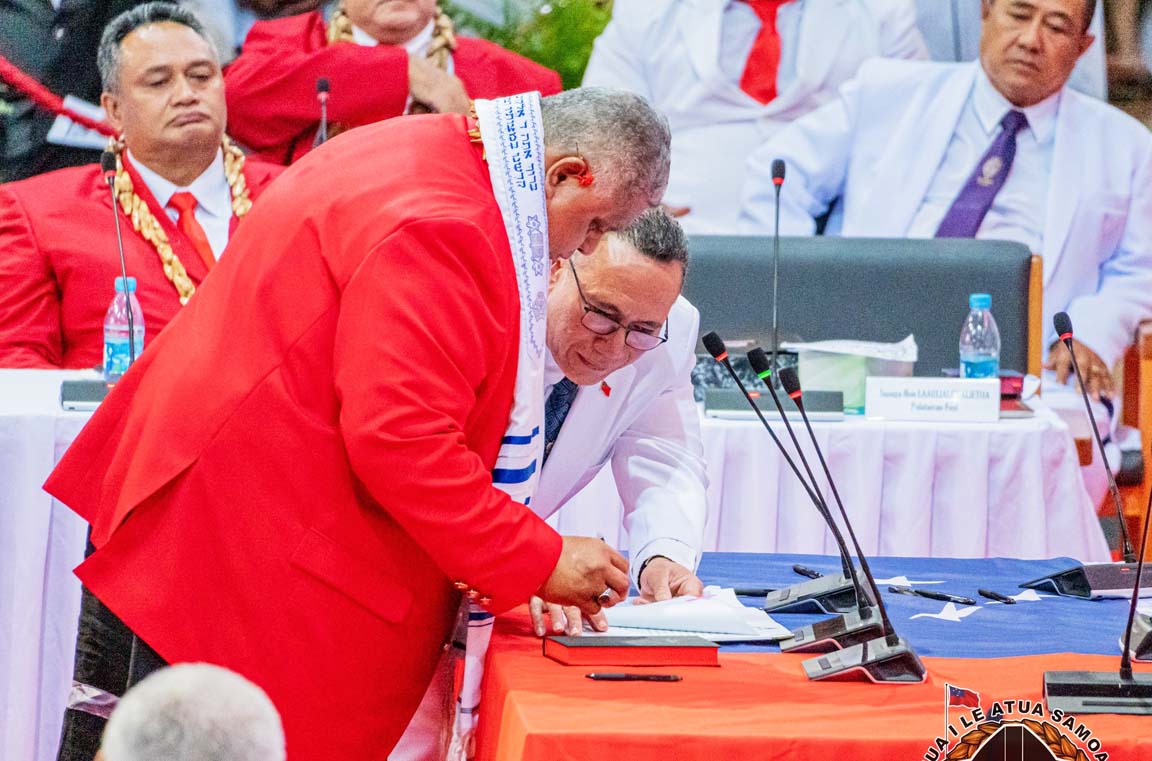 Agafili helping Laauli with papers