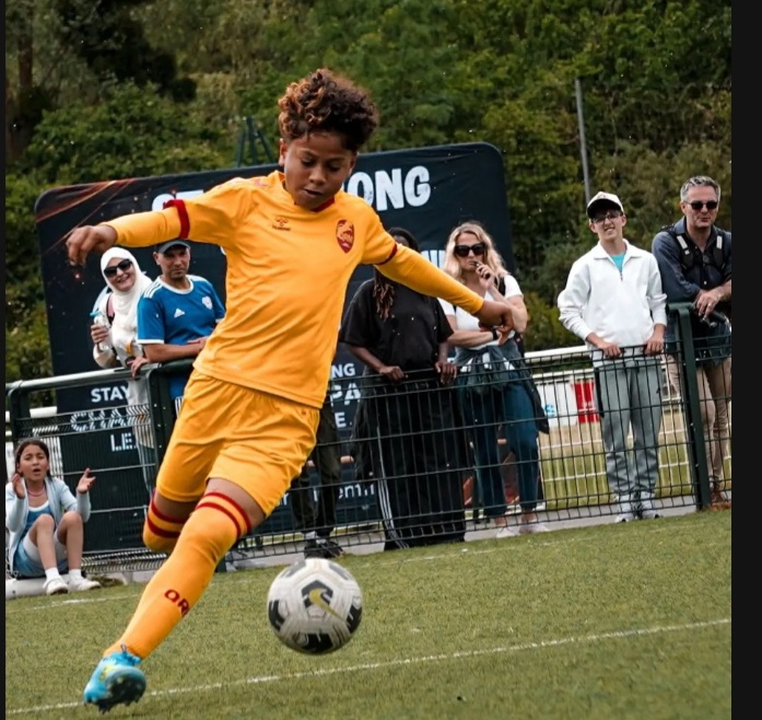 soccer player in yellow uniform